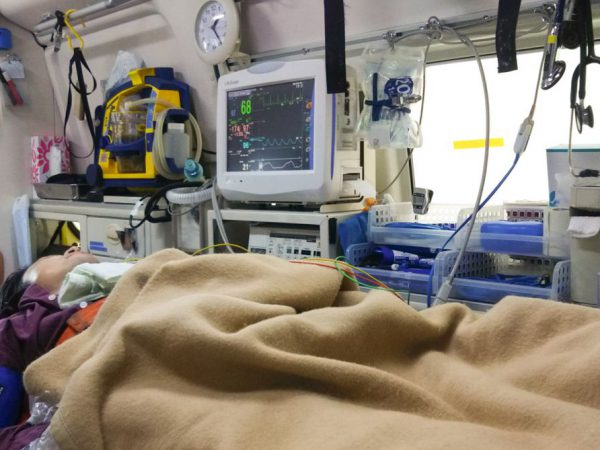 Asian male patient in ambulance